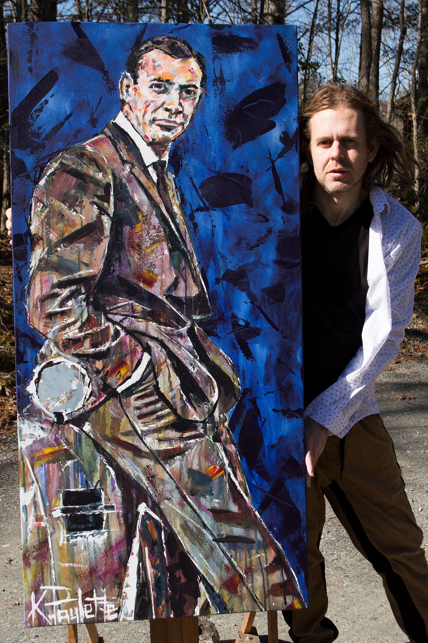 Prime 21 Banner Elk artwork of James Bond portrait of Sean Connery with artist Kent Paulette standing next to the painting.